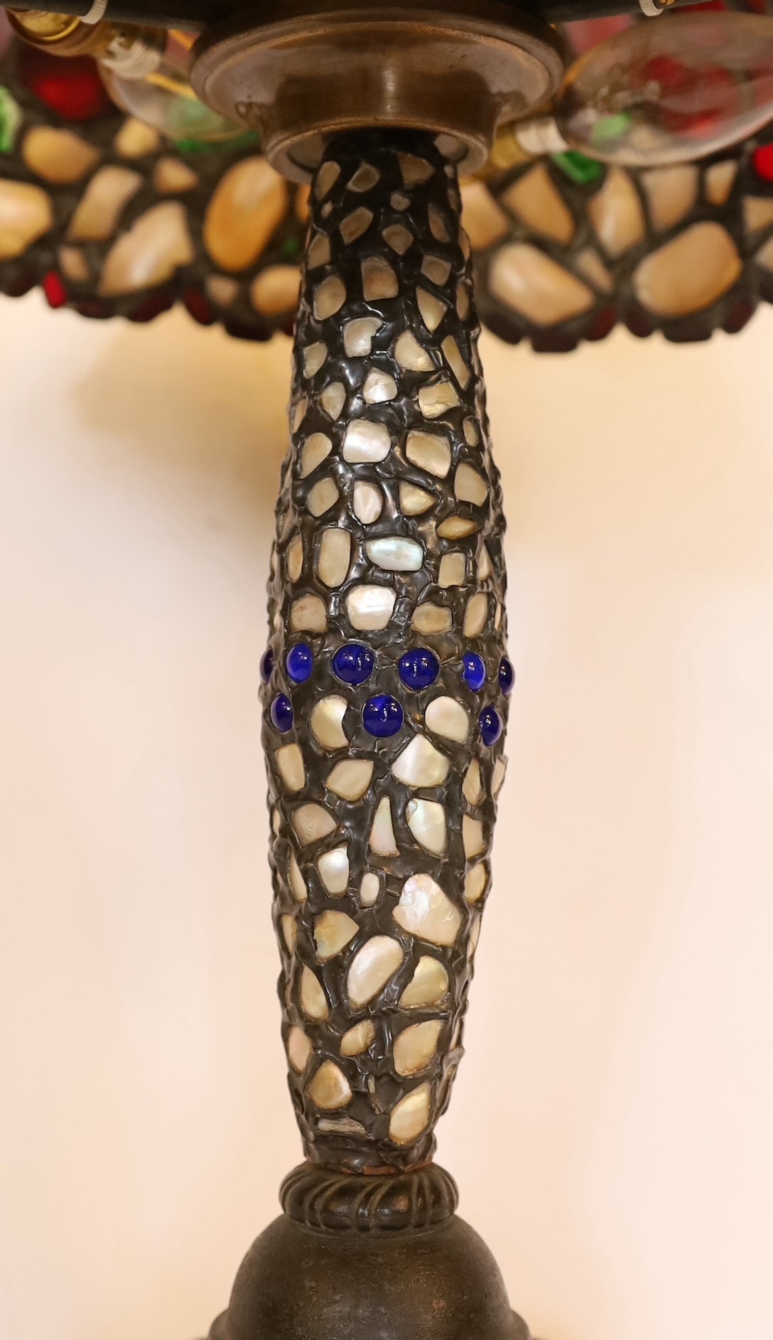 A 1920s Austrian stained glass and mother-of-pearl table lamp with domed shade, height 48cm